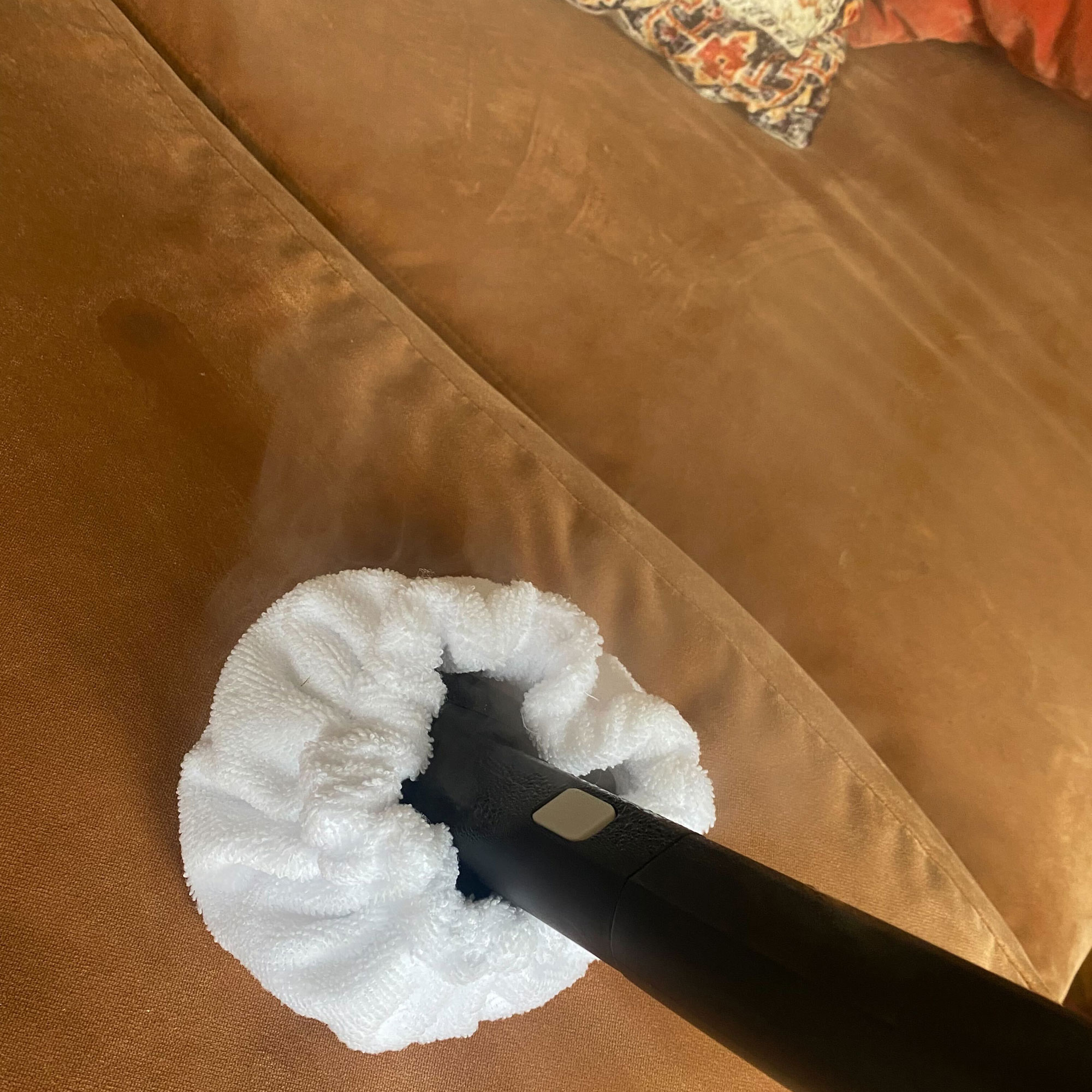 using the dupray neat steam cleaner on sofa