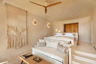 Bedroom at six senses shaharut, seating and cream walls