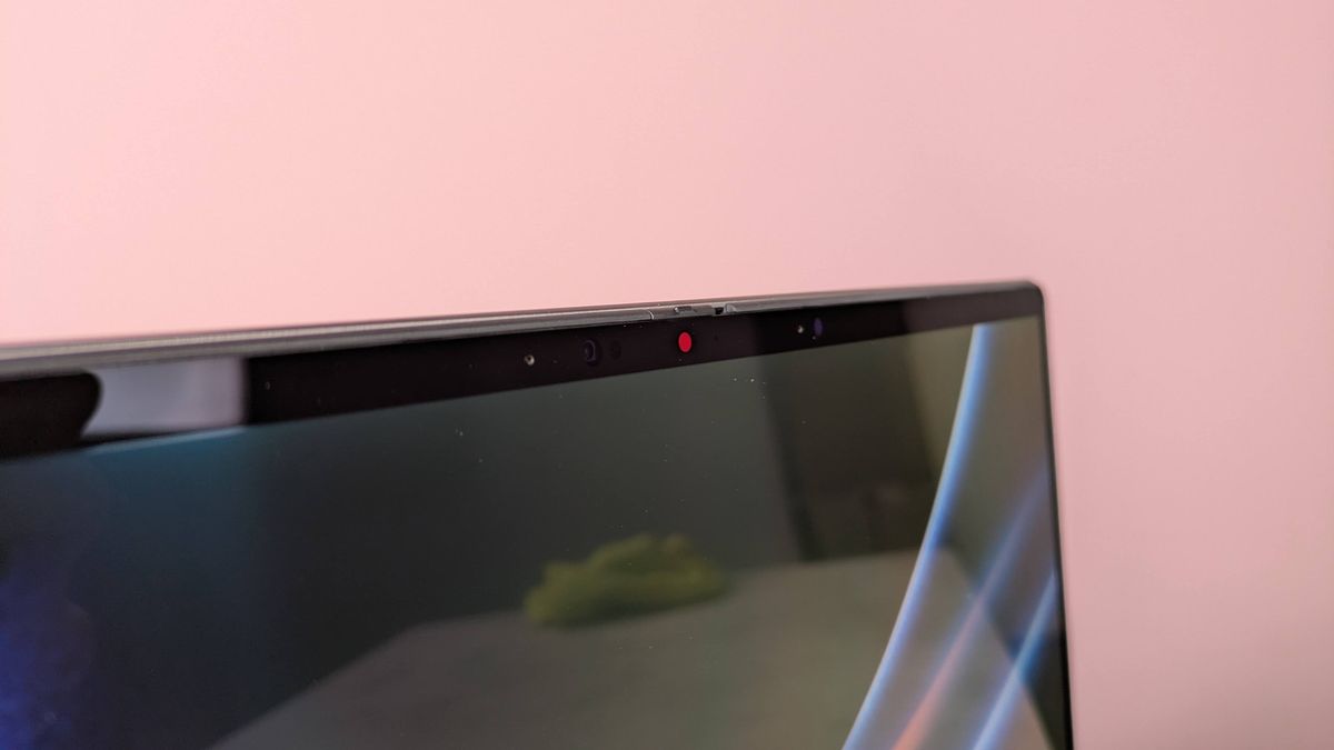 Close-up of webcam on MSI Prestige 14 Flip AI+, with pink wall in background