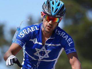 Shlomi Haimy of Israel drops a water bottle in the feed zone during in the Mens' Cross-country Mountain Bike Cycling during day one of the Baku 2015 European Games