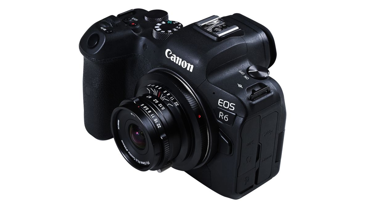 Laowa 15mm f/5 Cookie FF lens, mounted to a camera, against a white background