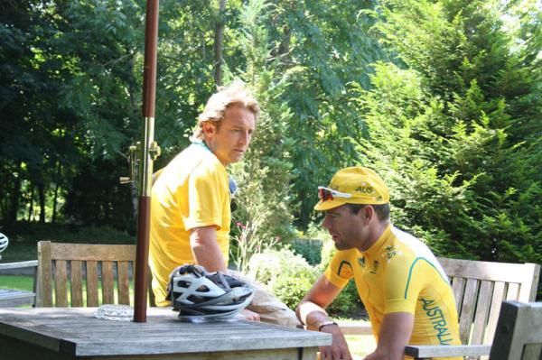 Matt White and Cadel Evans talk after a training ride in Surrey, England