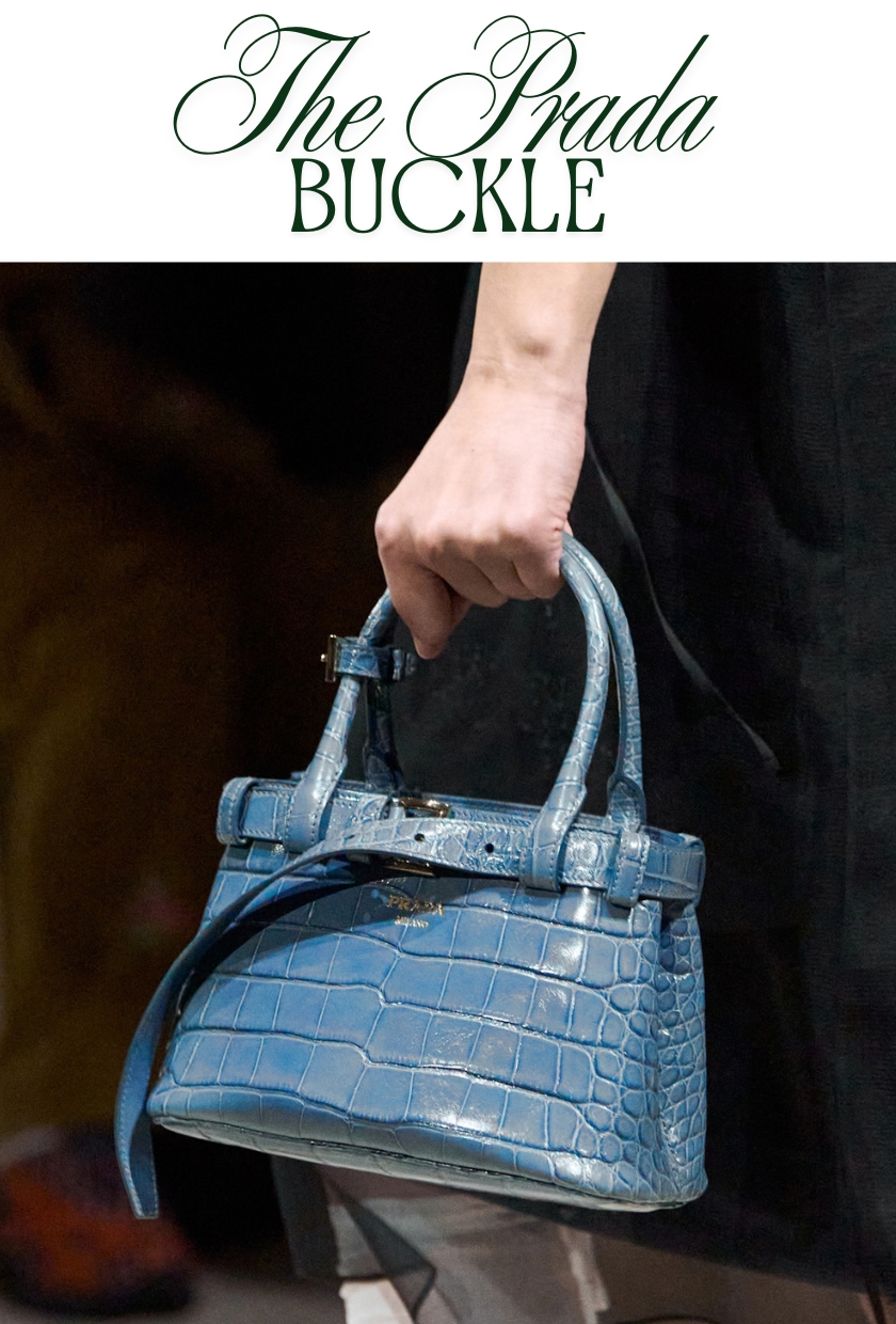 Autumn winter it bags 2026: Model carries a blue mock croc Prada buckle bag