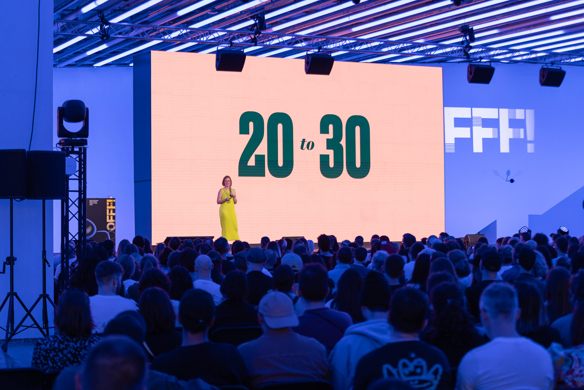 Jessica Hische on stage at OFFF Barcelona in front of a stage that says '20 to 30'