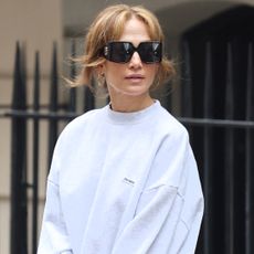 Jennifer Lopez in Manhattan wearing a gray sweatsuit