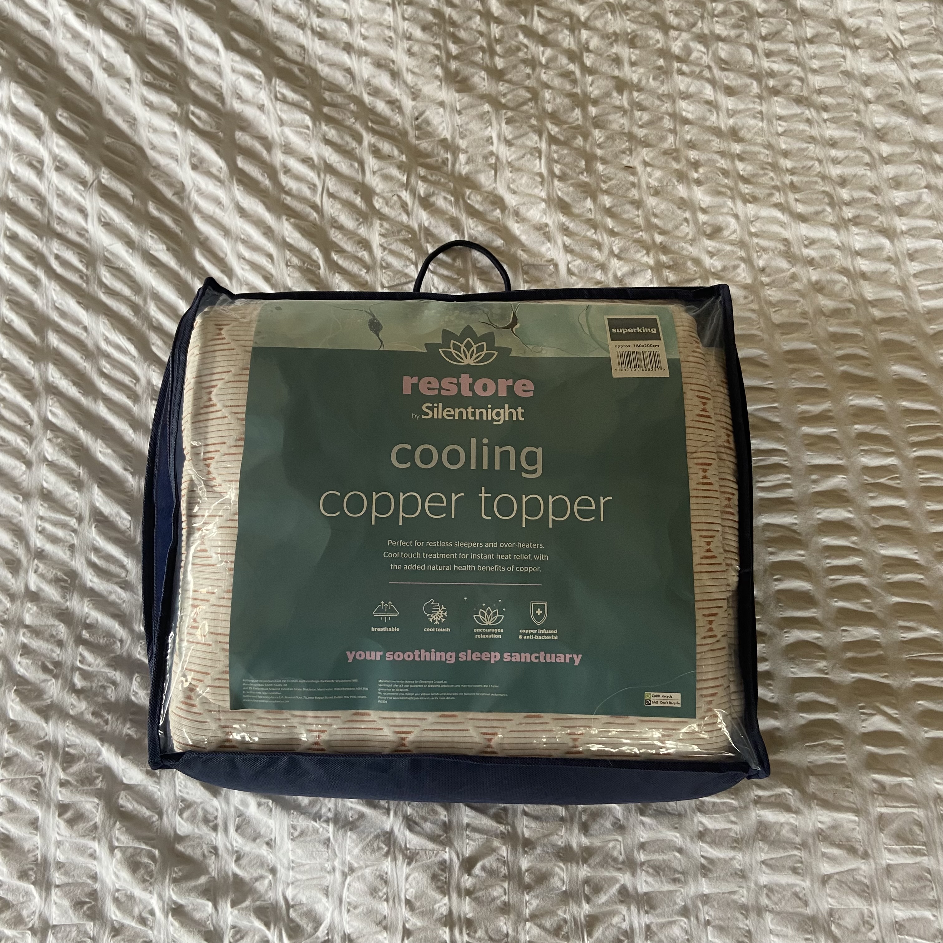 The Silentnight Restore Cooling Copper Topper being tested at home on a bed