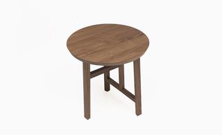Small circular oak coloured wooden coffee table