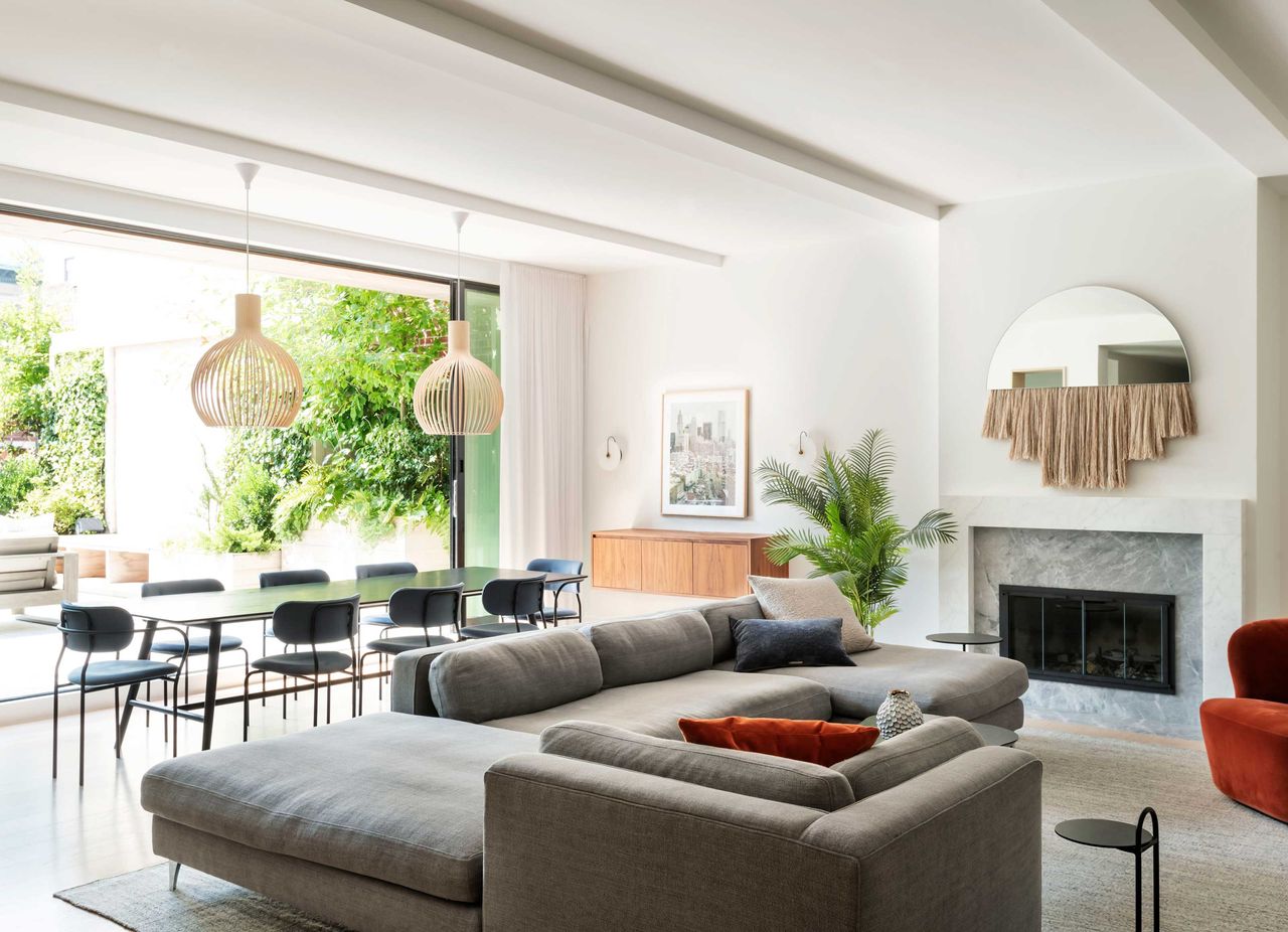 a living room with doors out to a terrace