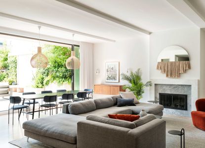 a living room with doors out to a terrace