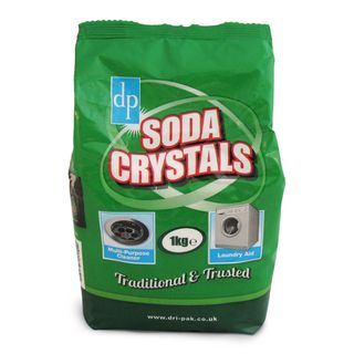 A bright green bag of soda crystals with red and white text