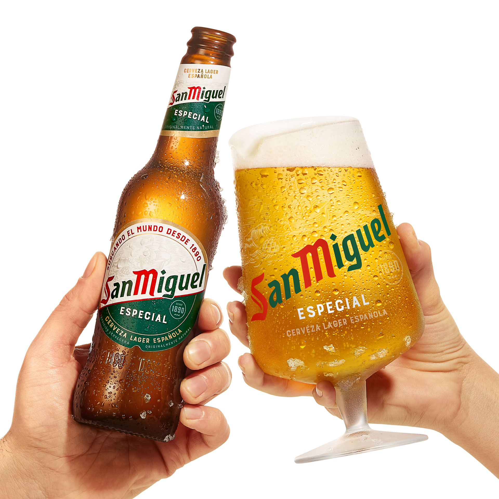 San Miguel bottle and glass held up by two separate hands