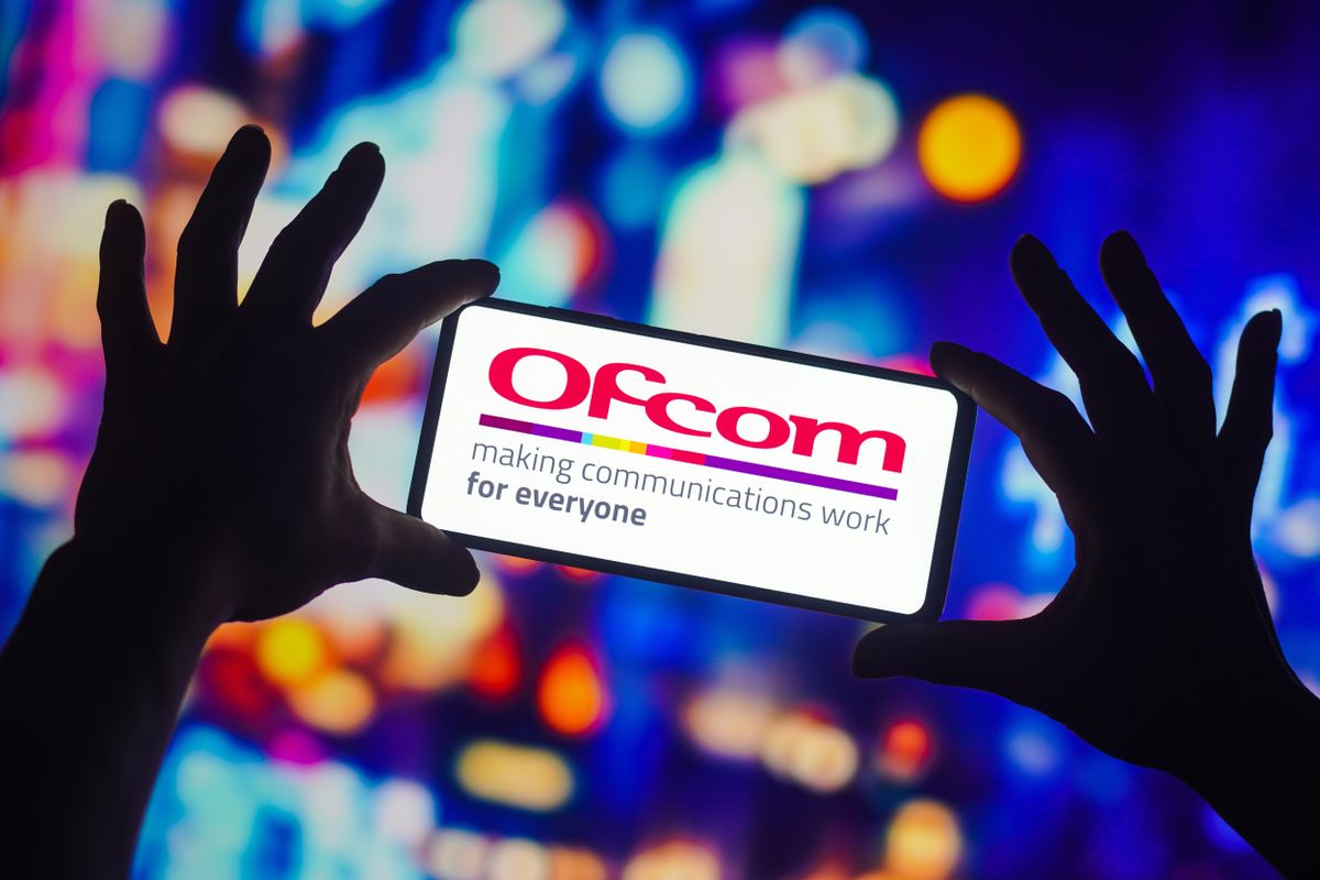 Ofcom logo displayed on a smartphone with multicolored background 