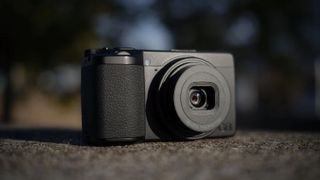 Ricoh GR IV Monochrome compact camera outdoors
