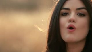 Lucy Hale singing in a music video