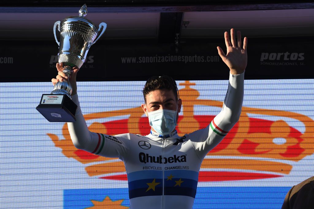 ROQUETAS DE MAR SPAIN FEBRUARY 14 Podium Giacomo Nizzolo of Italy and Team Team Qhubeka Assos Celebration during the 34th Clsica de Almeria 2021 a 1833km race from Pueblo de Vicar to Roquetas de Mar Trophy ClasicaAlmeria21 on February 14 2021 in Roquetas de Mar Spain Photo by Tim de WaeleGetty Images