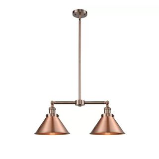 A dual copper pendant light with triangular shades and a long base
