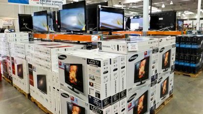 a display stack of large screen TV's at COSTCO