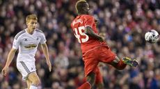 Mario Balotelli passes the ball in the League Cup Fourth Round football match between Liverpool and Swansea City