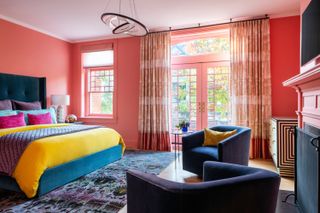 A bright toned bedroom with a yellow bedcover
