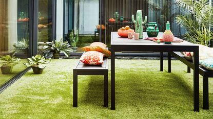 artificial grass in outdoor living space with seating
