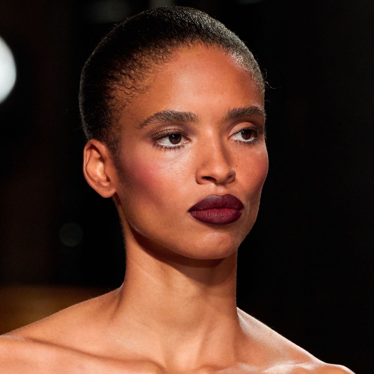 A woman with berry blush and lips.