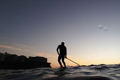 A man crossed the Atlantic Ocean on a paddleboard.