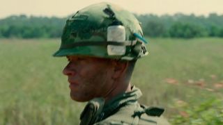 Tom Hanks in profile, wearing an army helmet in Forrest Gump