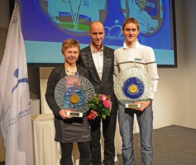 Tanja Žakelj and Matej Mohorič with Tomaž Grm, president of the Slovenian Cycling Federation
