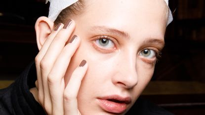 A model poses in the backstage of the Giada fashion show during the Milan Fashion Week - Spring / Summer 2022 on September 22, 2021 in Milan, Italy. 