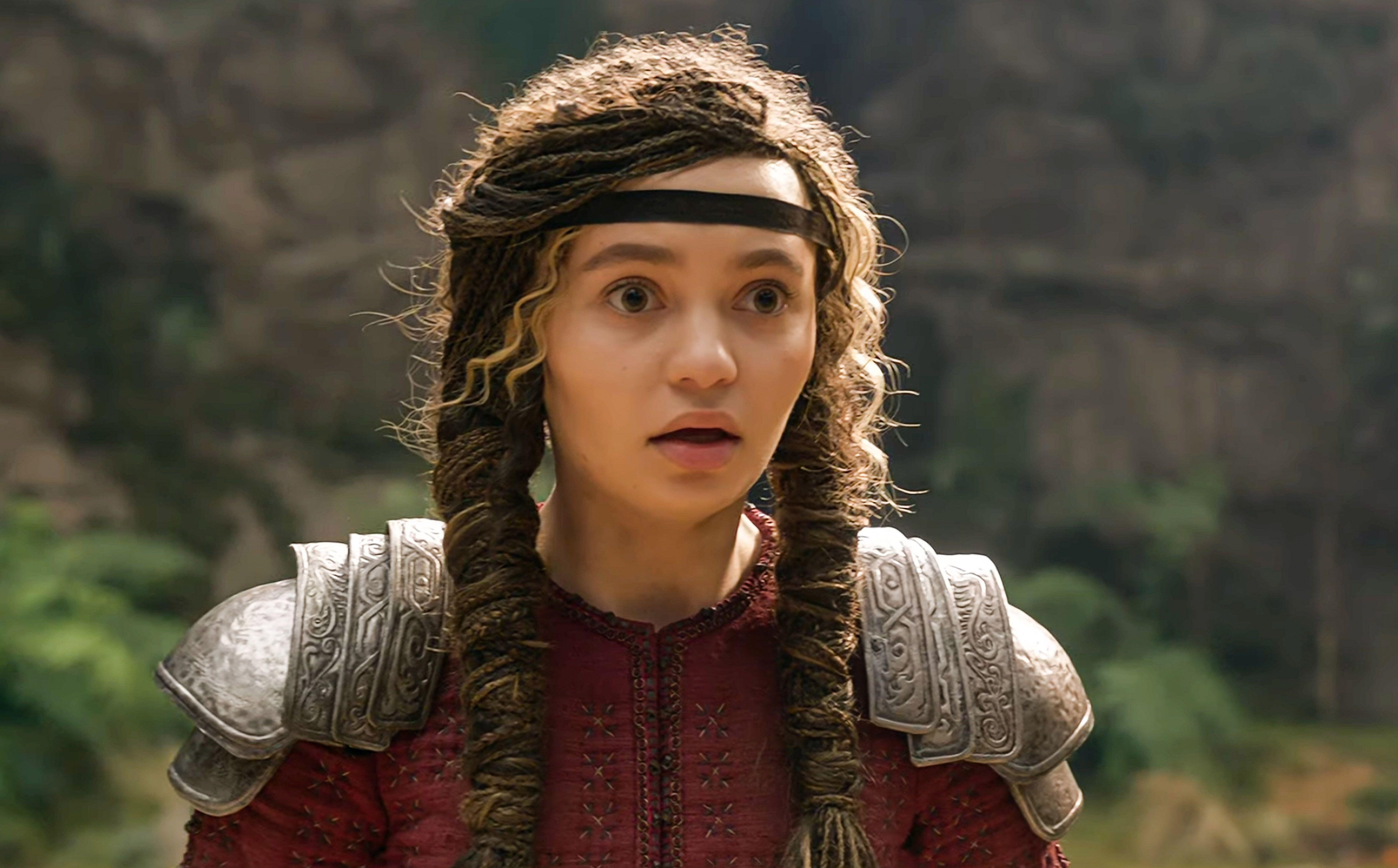 nico parker as astrid in the 2025 how to train your dragon live action movie, with two pigtail braids and a headband across her forehead, wearing shoulder armor