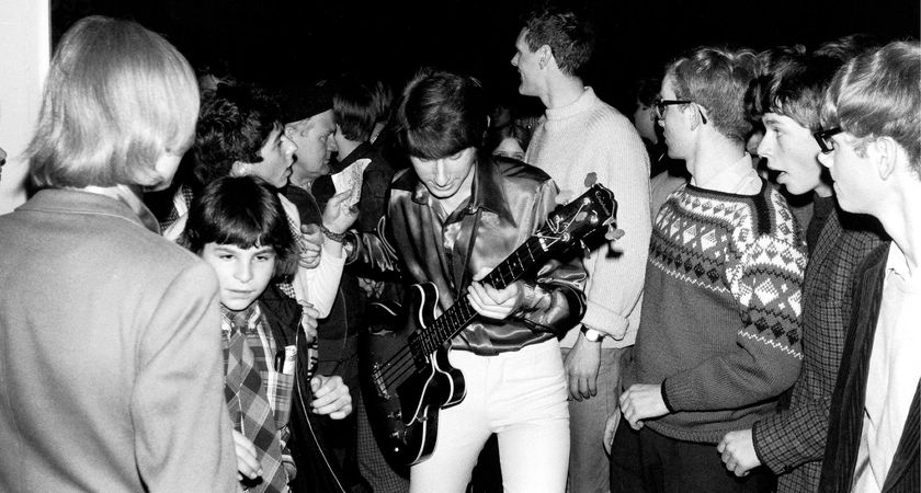 Chris Dreja of the Yardbirds holds his semi-hollow bass he is mobbed during the band's tour of Denmark