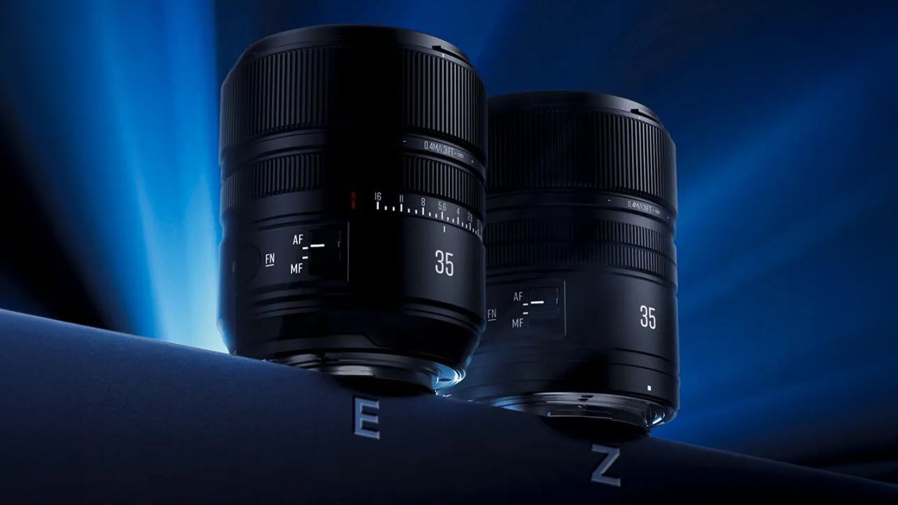 Two sleek black camera lenses with autofocus (AF) and manual focus (MF) settings, showcased against a dynamic blue background