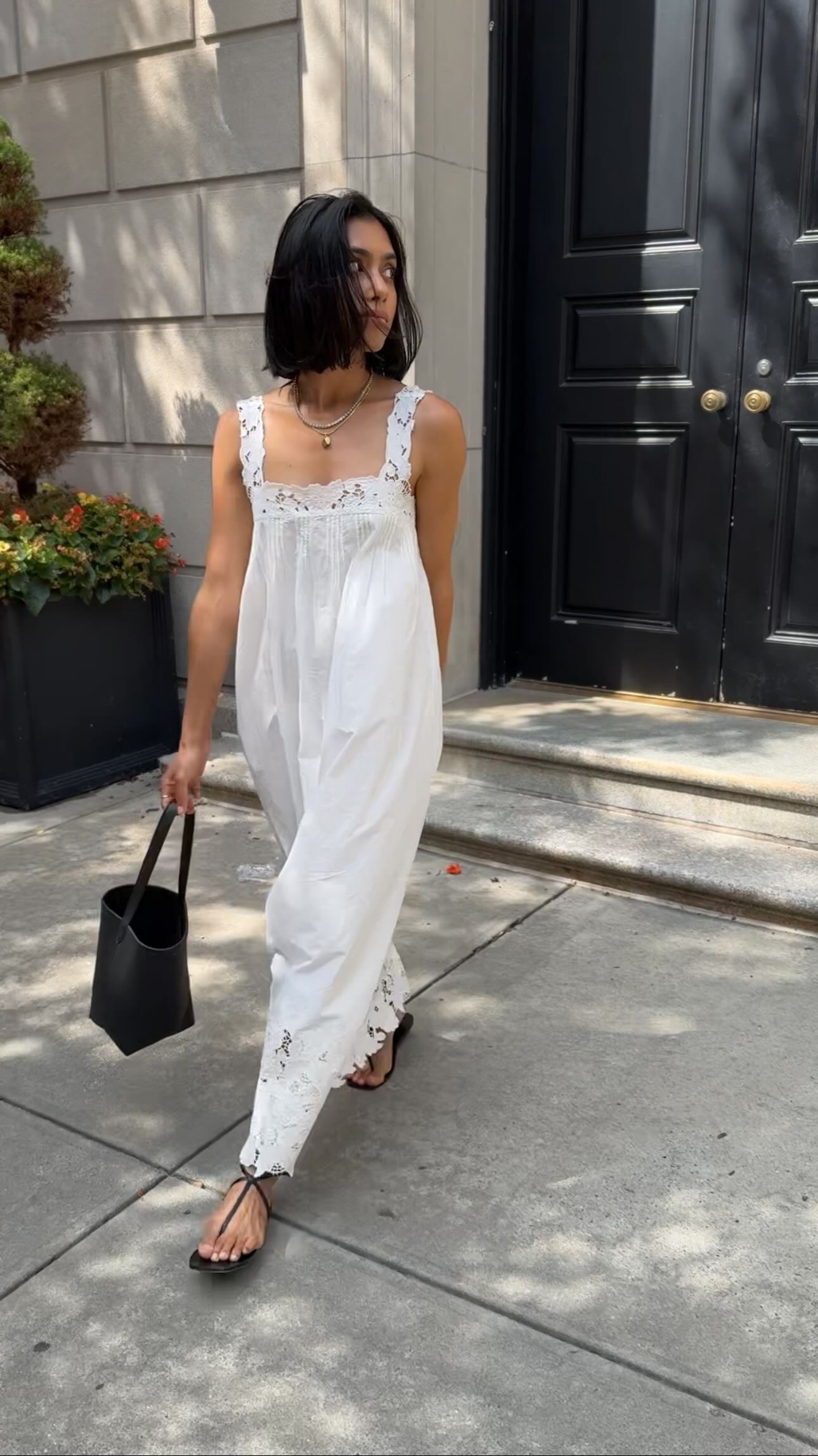Influencer wearing white nightgown dress.