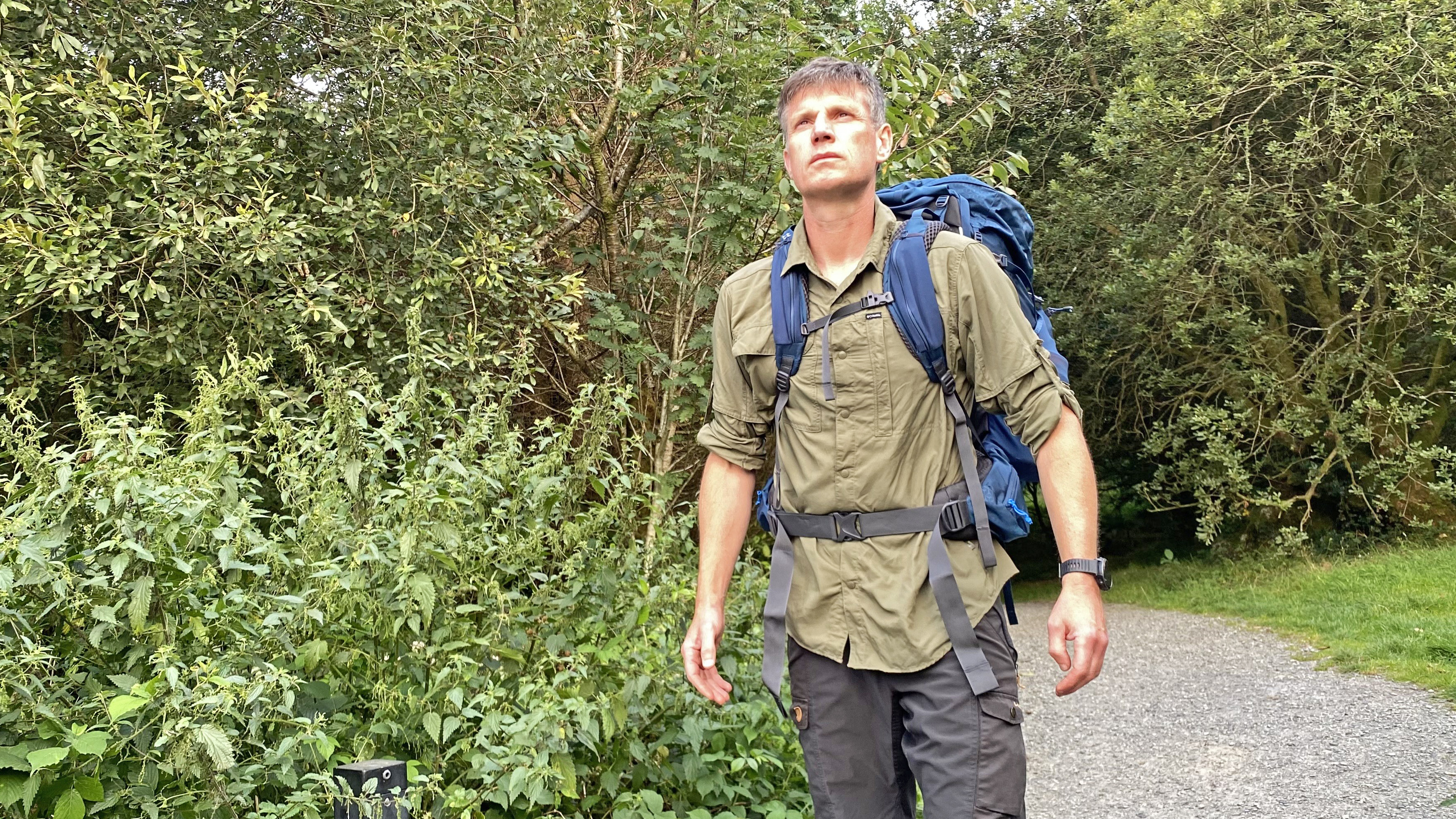 Hiker wearing the Rab Exion 55 Backpack