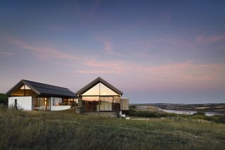 contemporary self build with lots of glazing and solar panels