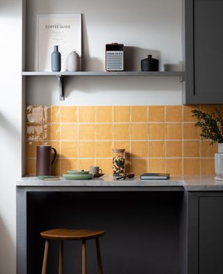 sunshine/ochre yellow kitchen tiles for small kitchen as a backsplash against dark gray cabinets