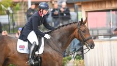 Becky Moody pats Jagerbomb after their grand prix special test at the 2025 European Championships