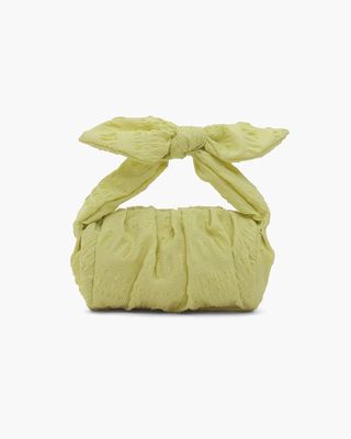 green textured bag with bow