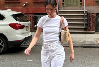 woman in white t-shirt and jeans