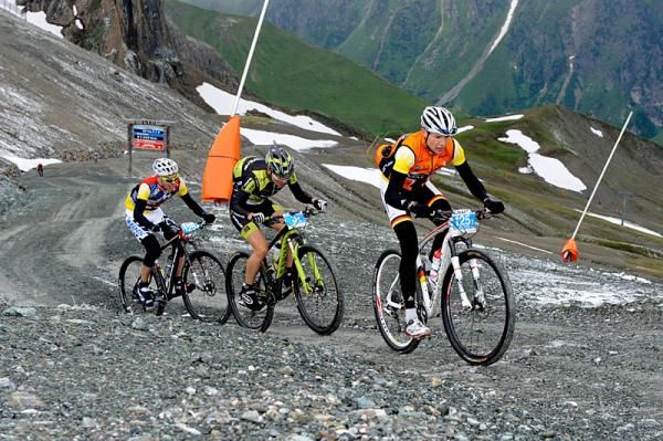 Break away group of Markus Kaufmann (Centurion-Vaude), Robert Mennen (Topeak Ergon Racing) and Thomas Stoll (BiXS iXS Pro Team) at top of high point of the 2012 TransAlp, the Idjoch (2,737m)
