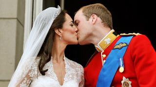 Prince William, Duke of Cambridge and Catherine, Duchess of Cambridge kiss on the balcony of Buckingham Palace after getting married on April 29, 2011 in London, England.