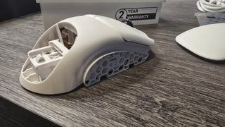 Orbital Pathfinder gaming mouse with various attachments.