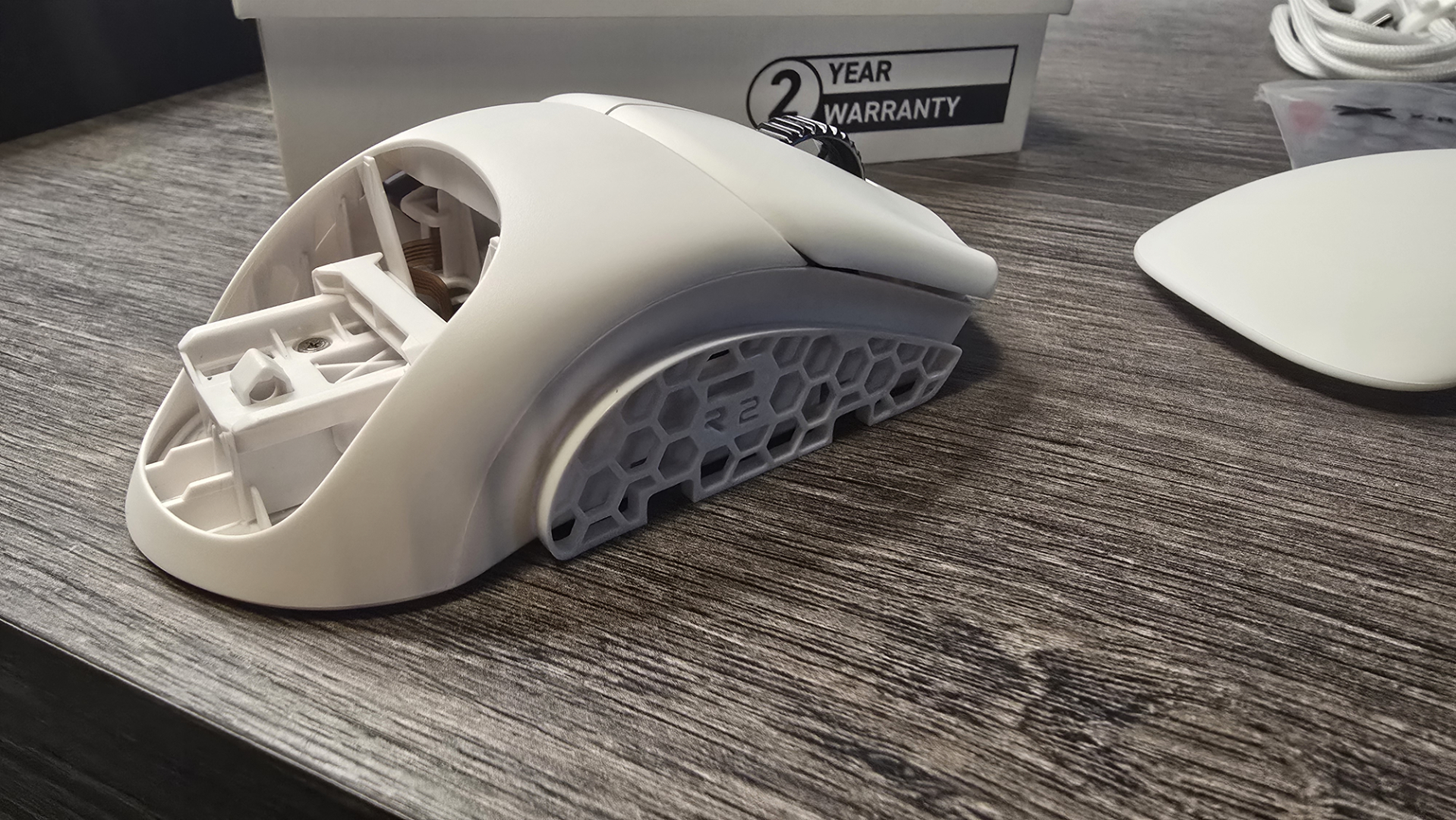 Orbital Pathfinder gaming mouse with various attachments.