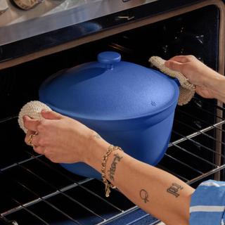 blue perfect pot being put in the oven