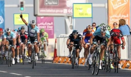 Francesco Chicchi celebrates as his teammate speeds to the win
