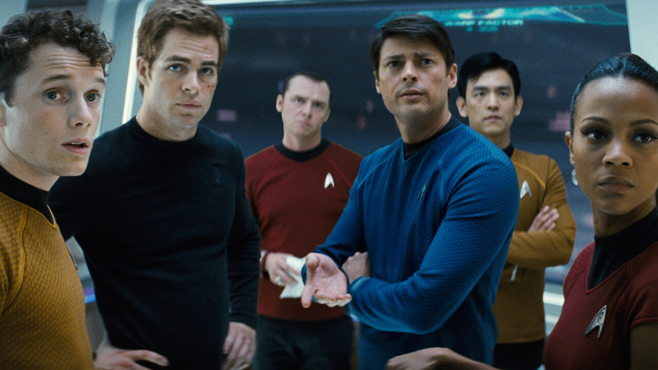 The crew of the USS Enterprise look back at someone off camera in 2009's Star Trek movie