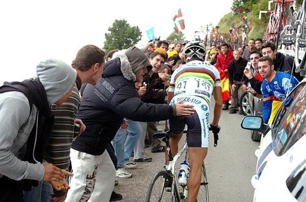 Paolo Bettini (Quick Step) gets a little help.