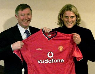 Forlan (right) was brought in by United boss Sir Alex Ferguson (left) on a four-and-a-half year deal (Martin Rickett/PA).