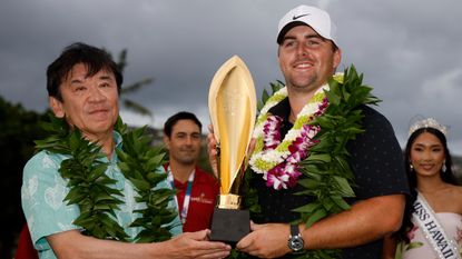 Chris Gotterup with the Sony Open in Hawaii trophy 