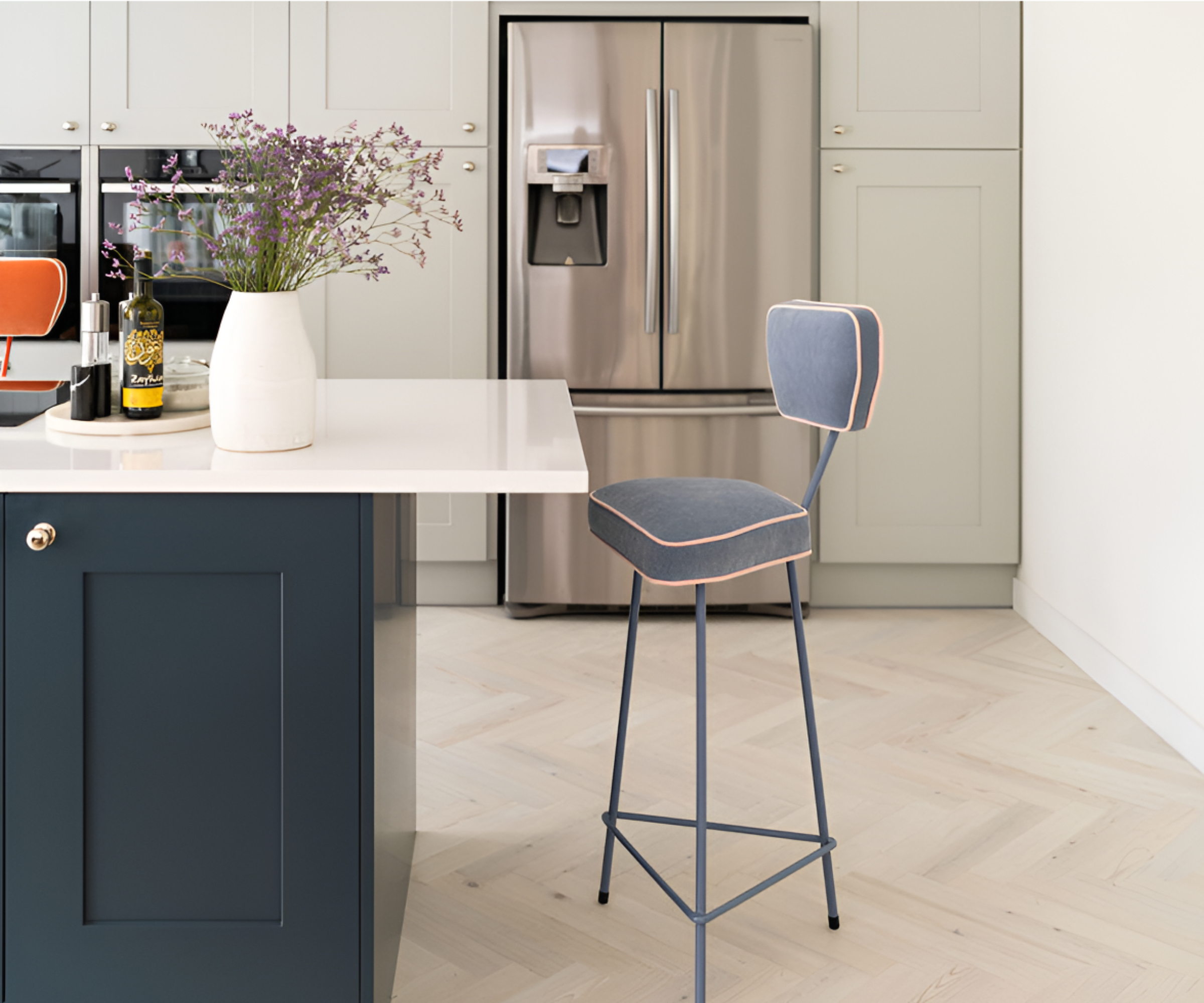 simple white overhang breakfast bar with velvet and metal bar stool